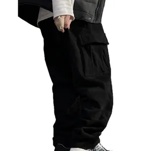 Detail view of black corduroy cargo pants featuring side pockets and loose fit style
