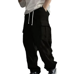 Close-up detail of black corduroy cargo pants featuring white drawstring and side pocket
