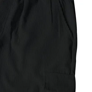Detail of black corduroy fabric and cargo pocket on men's retro casual pants.