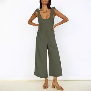 Solid olive green wide-leg jumpsuit for women with tie-shoulder straps and deep U-neckline