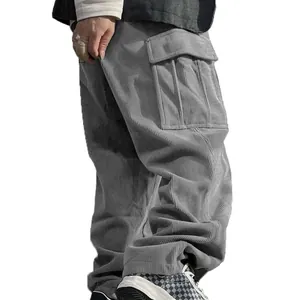Detailed side view of men's grey corduroy cargo pants showing texture and large utility pocket
