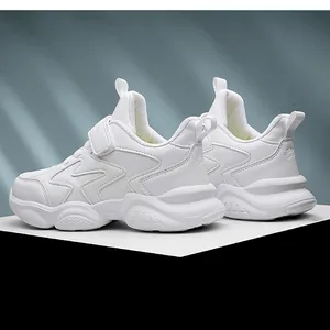 Detailed side view of white kids' sports shoes with breathable mesh and velcro strap