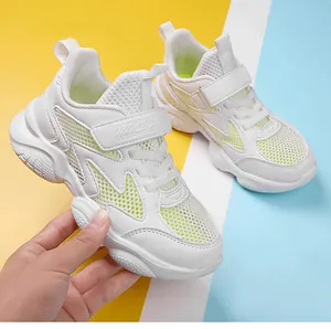 Breathable white and green kids sneakers with velcro strap detail