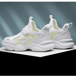 Breathable white children's running shoes with mesh panels and adjustable velcro strap