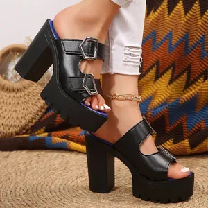 Detailed view of black platform chunky heel sandals with double buckles and lug sole