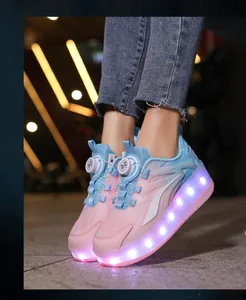 Detail view of pink and blue kids roller shoes featuring bright LED light soles