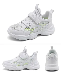 Detailed view of white breathable kids sneakers featuring fluorescent mesh accents