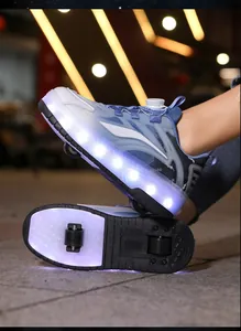 Close-up of children's LED roller shoes with double wheels and swivel buckle closure.