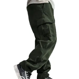 Detail view of men's retro green corduroy cargo pants featuring classic side pockets.