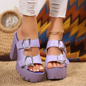 Close-up of purple platform chunky high heel sandals with silver buckles