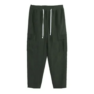 Men's dark green corduroy cargo pants detail with drawstring and large side pockets