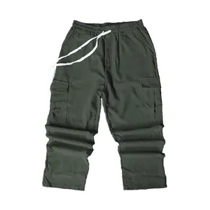 Detail view of men's retro olive green corduroy cargo pants with drawstring waist