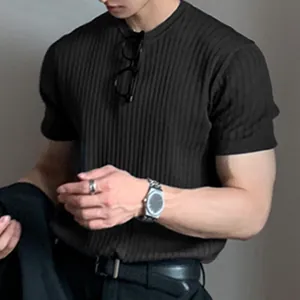 Close-up of men's black ribbed knit t-shirt featuring a stylish crew neck design.