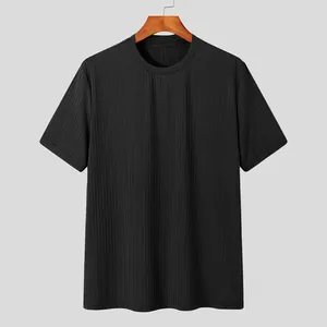 Detailed view of black vertical ribbed knit texture on a relaxed fit men's T-shirt