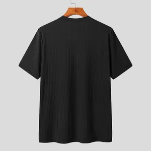 Close-up back view showing vertical ribbed texture of a black short-sleeved knitted t-shirt