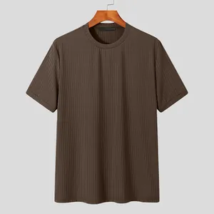 Detailed view of brown men's short sleeve t-shirt featuring vertical ribbed texture