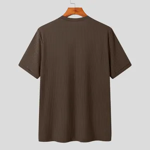 Back view of a men's brown ribbed knit short sleeve t-shirt in a relaxed fit