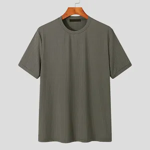 Close-up of a men's olive green rib-knit t-shirt with a classic crew neck design.