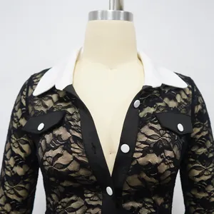 Exquisite detailed shot of black floral lace jumpsuit with elegant white contrast collar