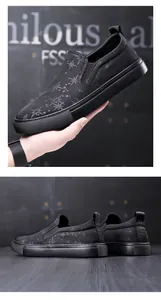 Macro detail showing the texture and star print of these black men's slip-on loafers.