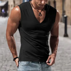 Close-up of men's muscle fit V-neck black sleeveless vest in urban street setting