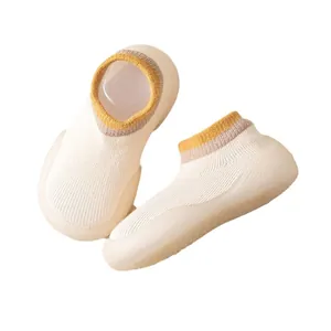 Soft-sole breathable baby sock shoes with yellow ribbed cuffs for indoor walking