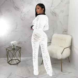 Back view of elegant white lace long sleeve jumpsuit with contrast black collar and cuffs