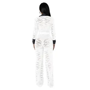 Back view of a white floral lace jumpsuit with black contrast collar and sleeves