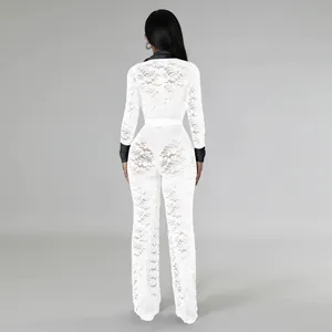 Back view of elegant white lace jumpsuit with black contrast sleeves and collar