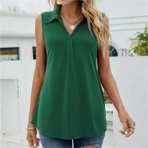Close-up detail of a dark green sleeveless V-neck top with a stylish pleated collar design.