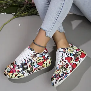Detail shot of colorful graffiti printed platform sneakers with white laces.