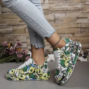 Vibrant graffiti platform sneakers with heart and poker patterns and thick white laces.