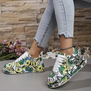 Close-up detail of women's vibrant graffiti print platform sneakers worn by model