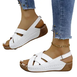 Comfortable white wedge sandals for women featuring platform sole and cross-strap design
