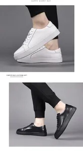 Detalle de zapatillas de cuero para hombre hechas a mano en color blanco y negro