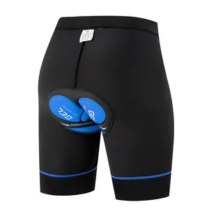 Detail view of black cycling shorts with blue gel anti-shock padding for mountain biking.