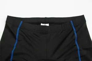 Close-up of black cycling shorts waistband with blue stitching and size tag
