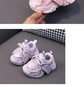 Detailed view of breathable mesh toddler sneakers with heart and strap decorations