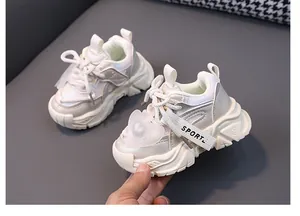 Detailed view of cream toddlers' mesh sneakers featuring a heart charm and Sport strap detail