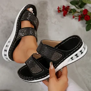 Detail view of women's black rhinestone platform sandals with air cushion sole 2025