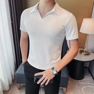Detail view of a men's slim-fit white V-neck short-sleeved Polo shirt in a home setting