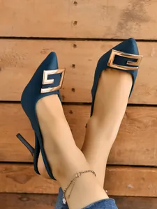 Elegant blue pointed toe slingback high heels featuring a prominent decorative gold metal buckle