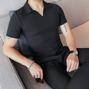 Close-up detail of a slim fit black men's V-neck polo shirt showing the collar and fit.