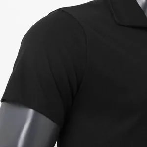 Close-up of black breathable polo shirt showing fabric texture and sleeve detail.