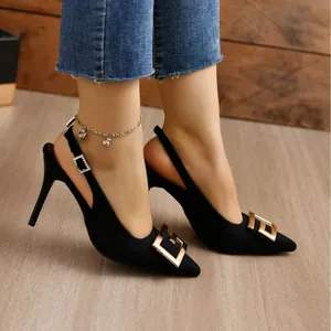 Elegant black pointed toe slingback stiletto heels with gold geometric buckle