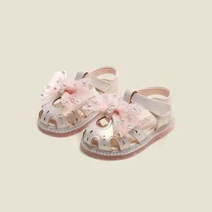 Sandales princesse champagne pour bébé fille avec nœud en strass et semelle souple