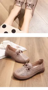 Detail view of purple hollow leather mom shoes with flower patterns and soft soles
