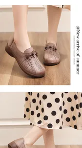 Detail of breathable hollow floral pattern on leather summer flats for women