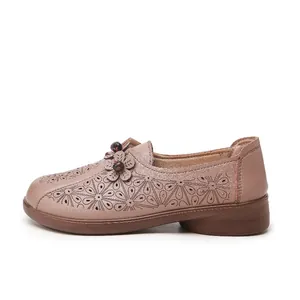 Comfortable hollow-out leather loafers for middle-aged women in taupe.