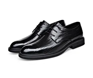 Detailed view of men's breathable black leather formal shoes with hollow perforation